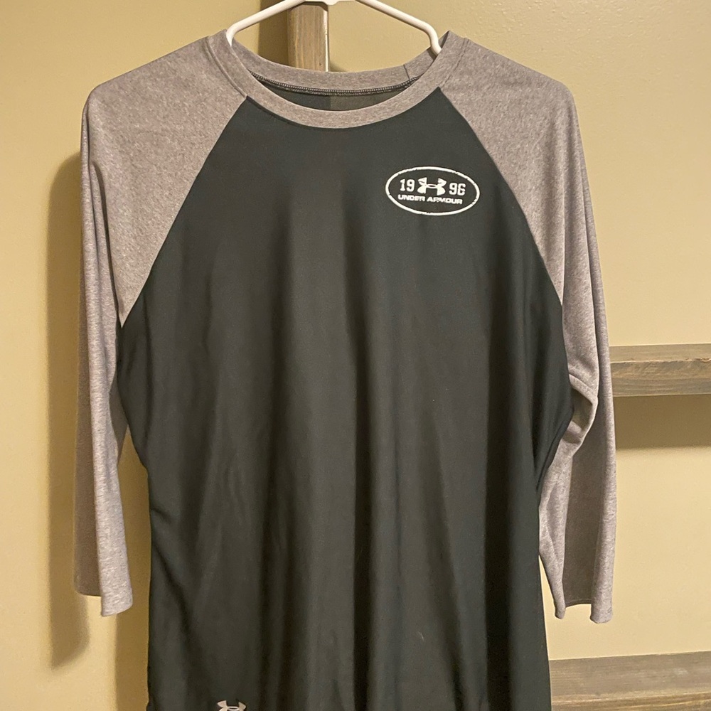 Under Armour light weight three quarter sleeve size large top. Worn once :)
